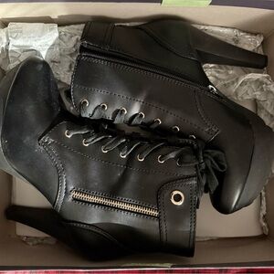 Gently used Jennifer Lopez Harper black heel boot for sale